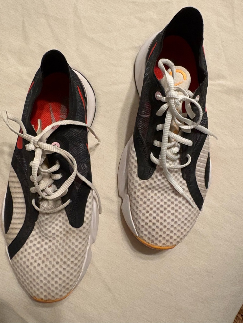 Nike Black Sneakers with Red Swoosh and Red Insole